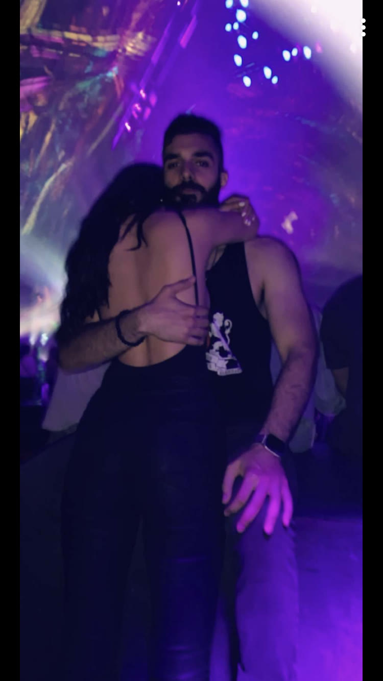 The two of us embracing beneath the pyramid